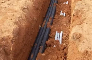 Armored direct burial fiber cable in trench Armored direct burial fiber cable in trench